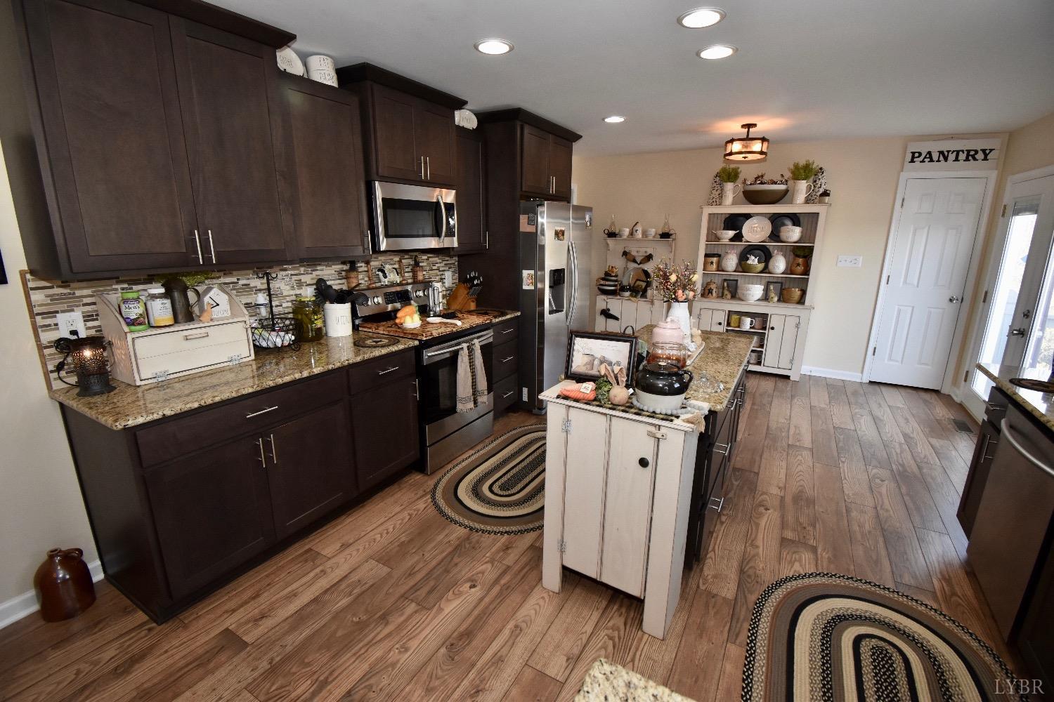 224 Tweedy Road Concord, VA 24538 - Photo 18 of 62 a kitchen with a sink appliances and cabinets