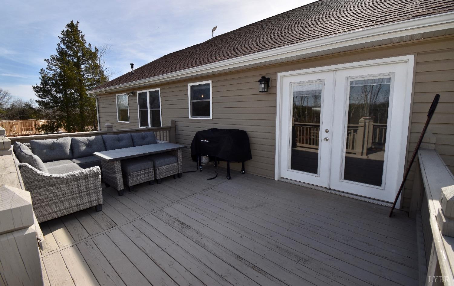 224 Tweedy Road Concord, VA 24538 - Photo 51 of 62 a view of a house with a barbeque and wooden floor