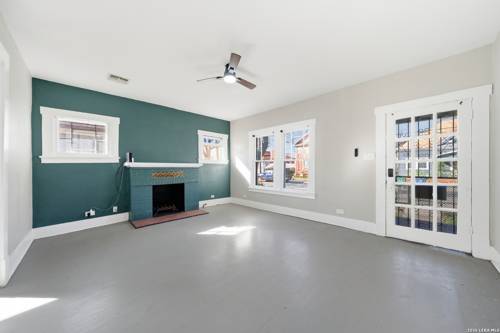 122 Biering Street, Unit 2 San Antonio, TX 78210 - Photo 2 of 8 a view of a livingroom with a fireplace and window