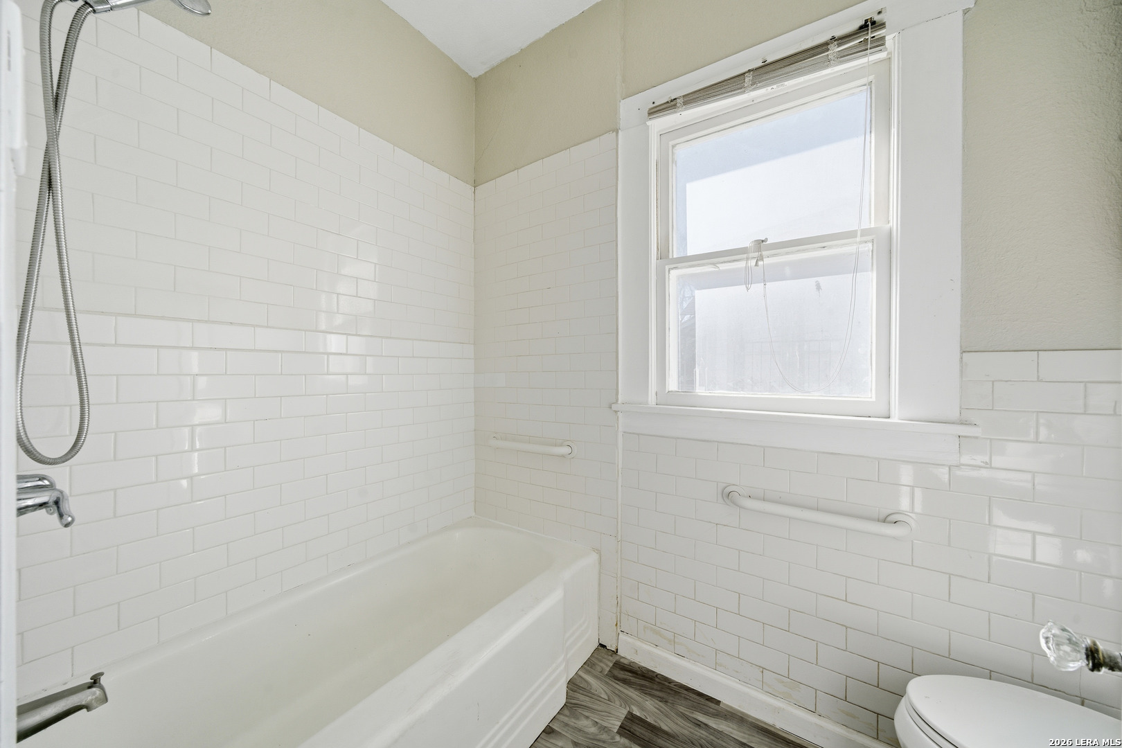 122 Biering Street, Unit 2 San Antonio, TX 78210 - Photo 7 of 8 a bath room with a toilet and a bath tub