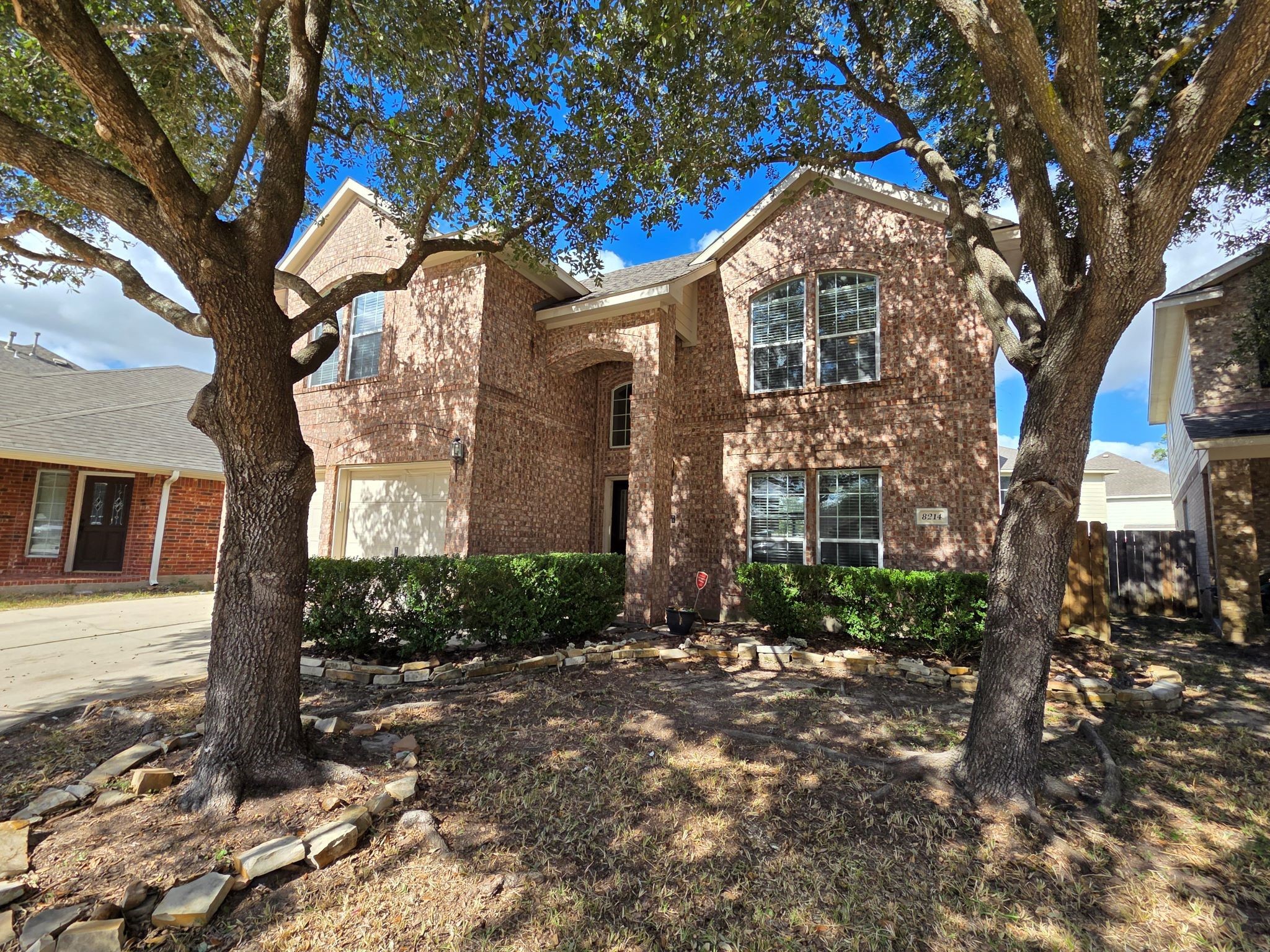 8214 Point Pendleton Drive Tomball, TX 77375 - Photo 2 of 42 a front view of a house with garden