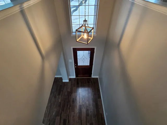 a view of entryway with wooden floor