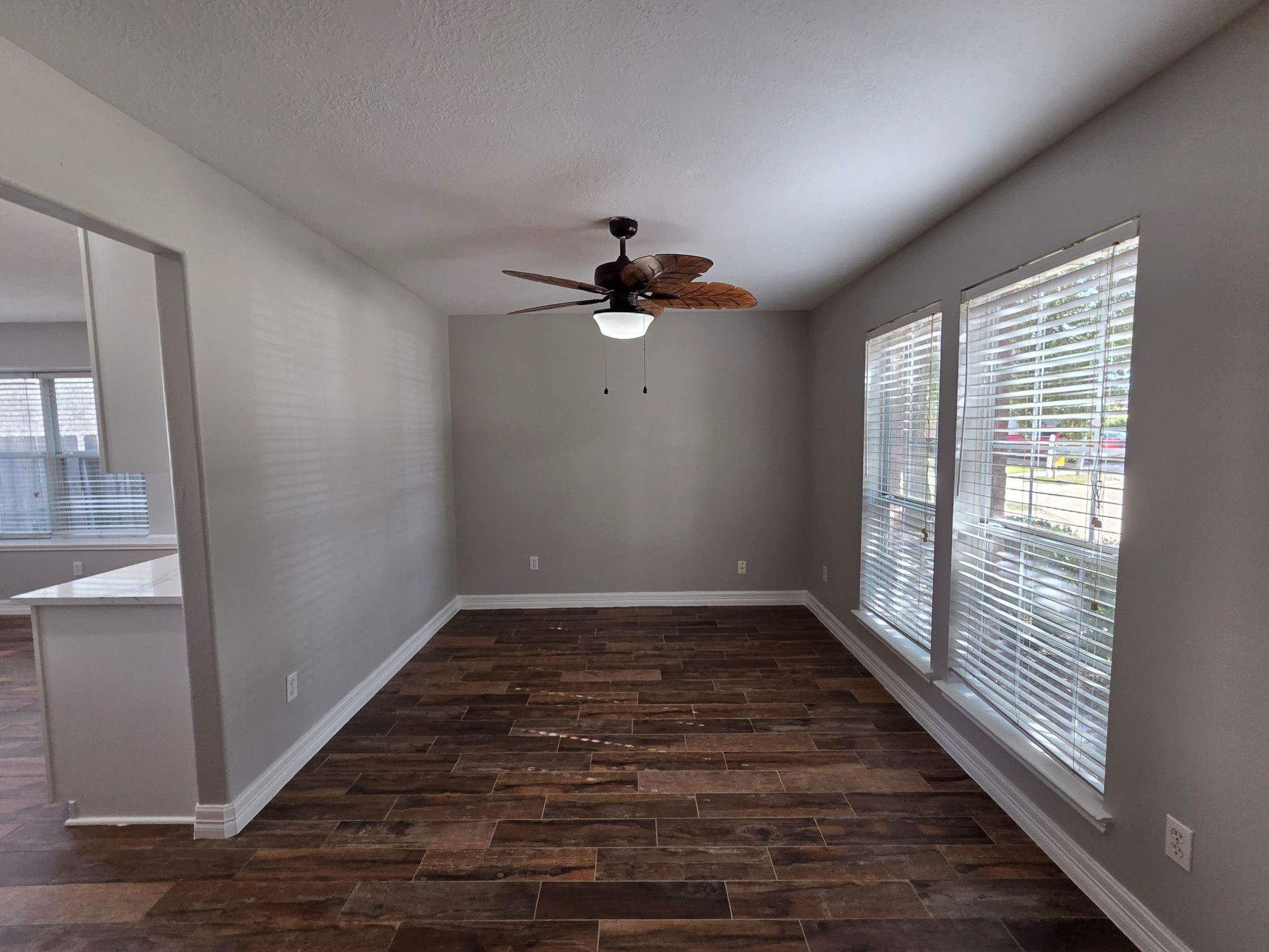 8214 Point Pendleton Drive Tomball, TX 77375 - Photo 10 of 42 a view of an empty room with wooden floor and a window