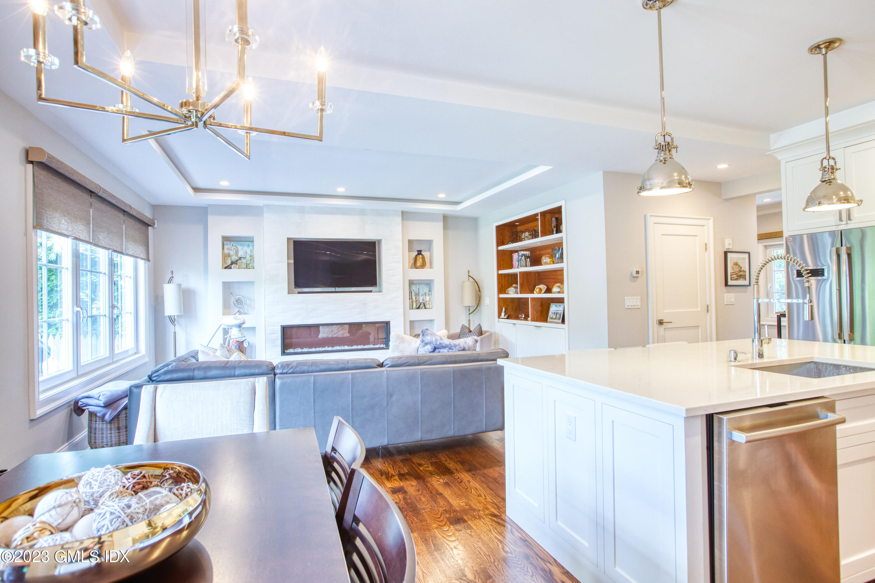 77 Ritch Avenue, Unit B Greenwich, CT 06830 - Photo 7 of 31 a living room with stainless steel appliances kitchen island granite countertop furniture and a flat screen tv