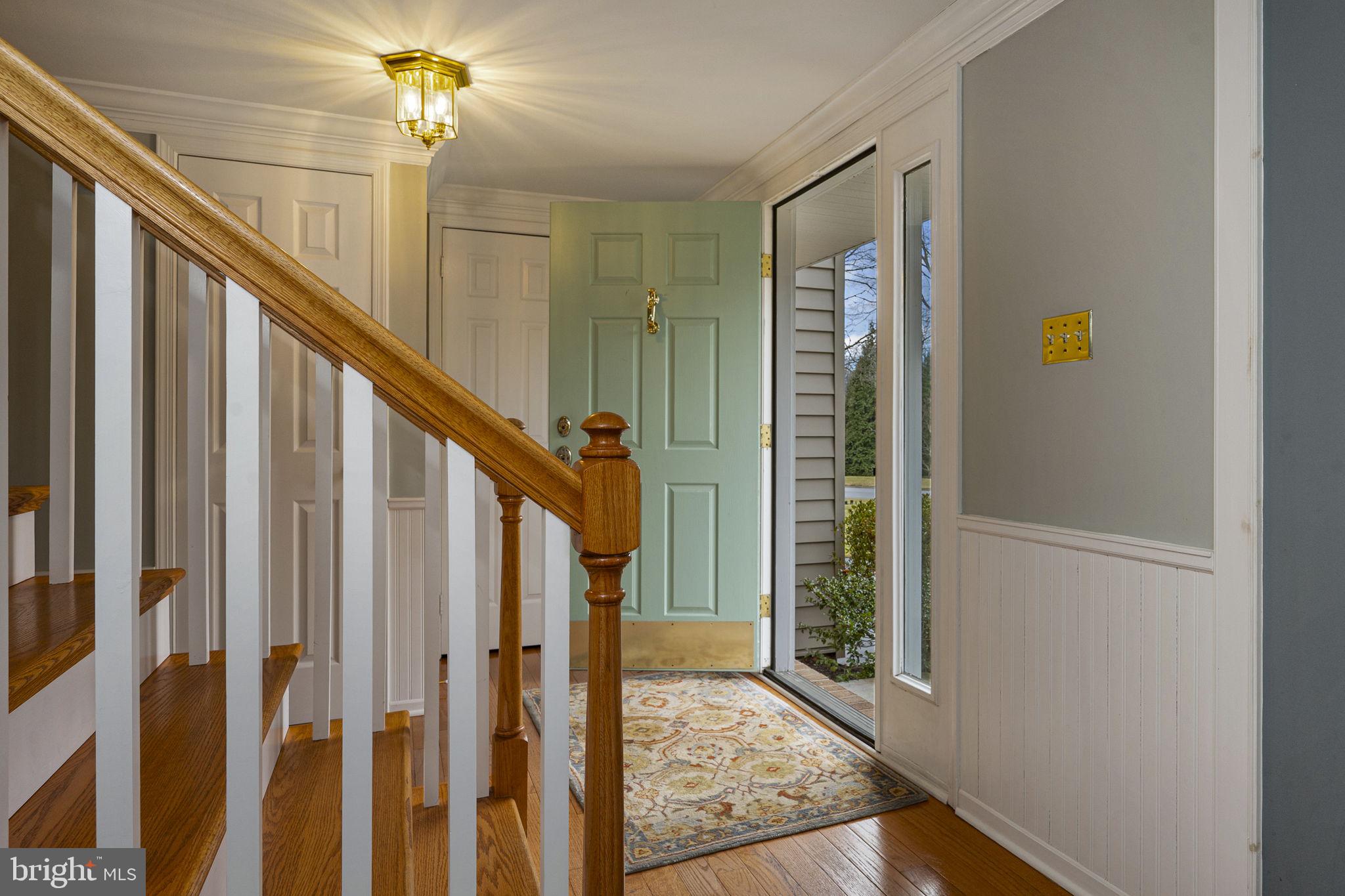 207 Overcreek Road Phoenixville, PA 19460 - Photo 11 of 47 a view of a hallway with wooden floor and staircase