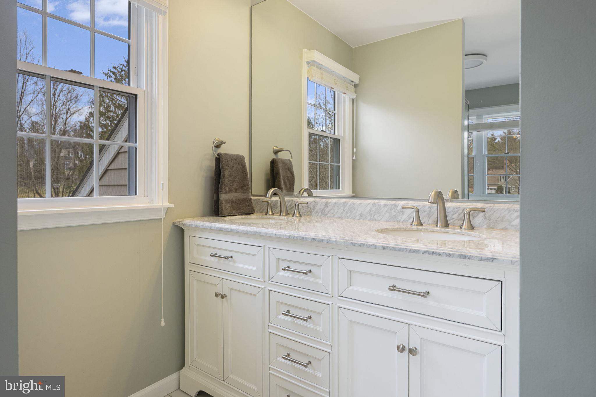 207 Overcreek Road Phoenixville, PA 19460 - Photo 27 of 47 a bathroom with a granite countertop sink and a mirror