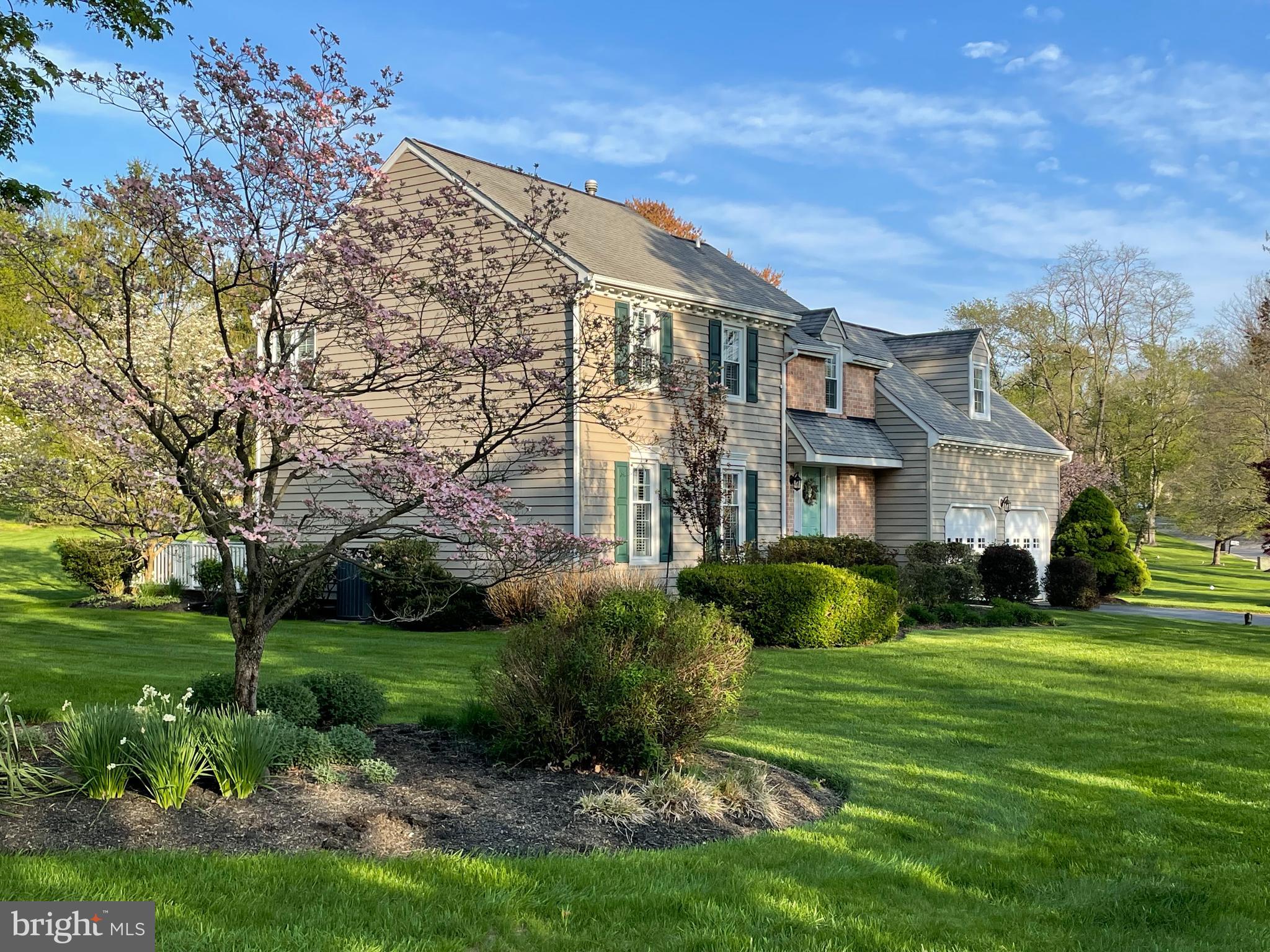 207 Overcreek Road Phoenixville, PA 19460 - Photo 3 of 47 a front view of a house with garden and trees