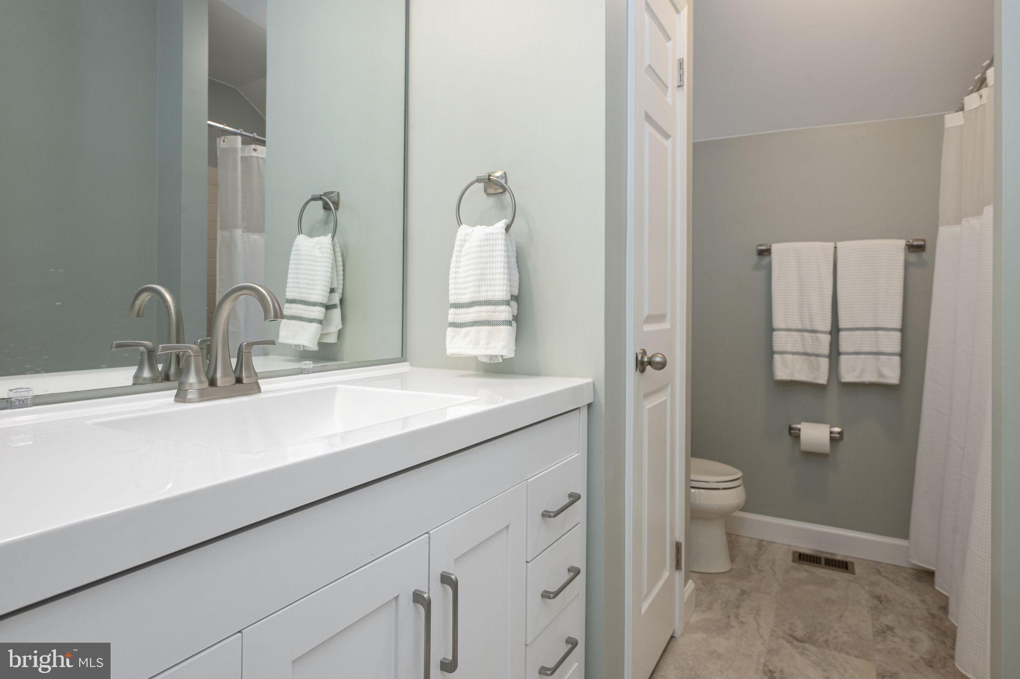 207 Overcreek Road Phoenixville, PA 19460 - Photo 33 of 47 a bathroom with a double vanity sink toilet and shower