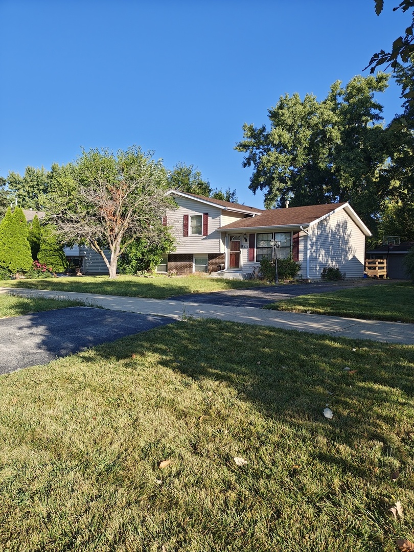 836 Lily Cache Lane Bolingbrook, IL 60440 - Photo 1 of 3 a front view of a house with a yard