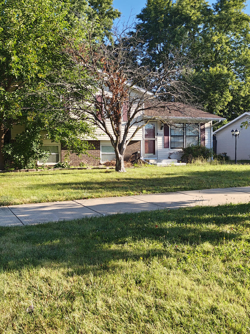 836 Lily Cache Lane Bolingbrook, IL 60440 - Photo 2 of 3 a front view of a house with a yard