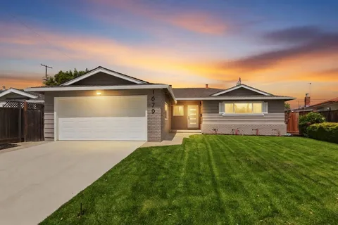 a front view of a house with yard