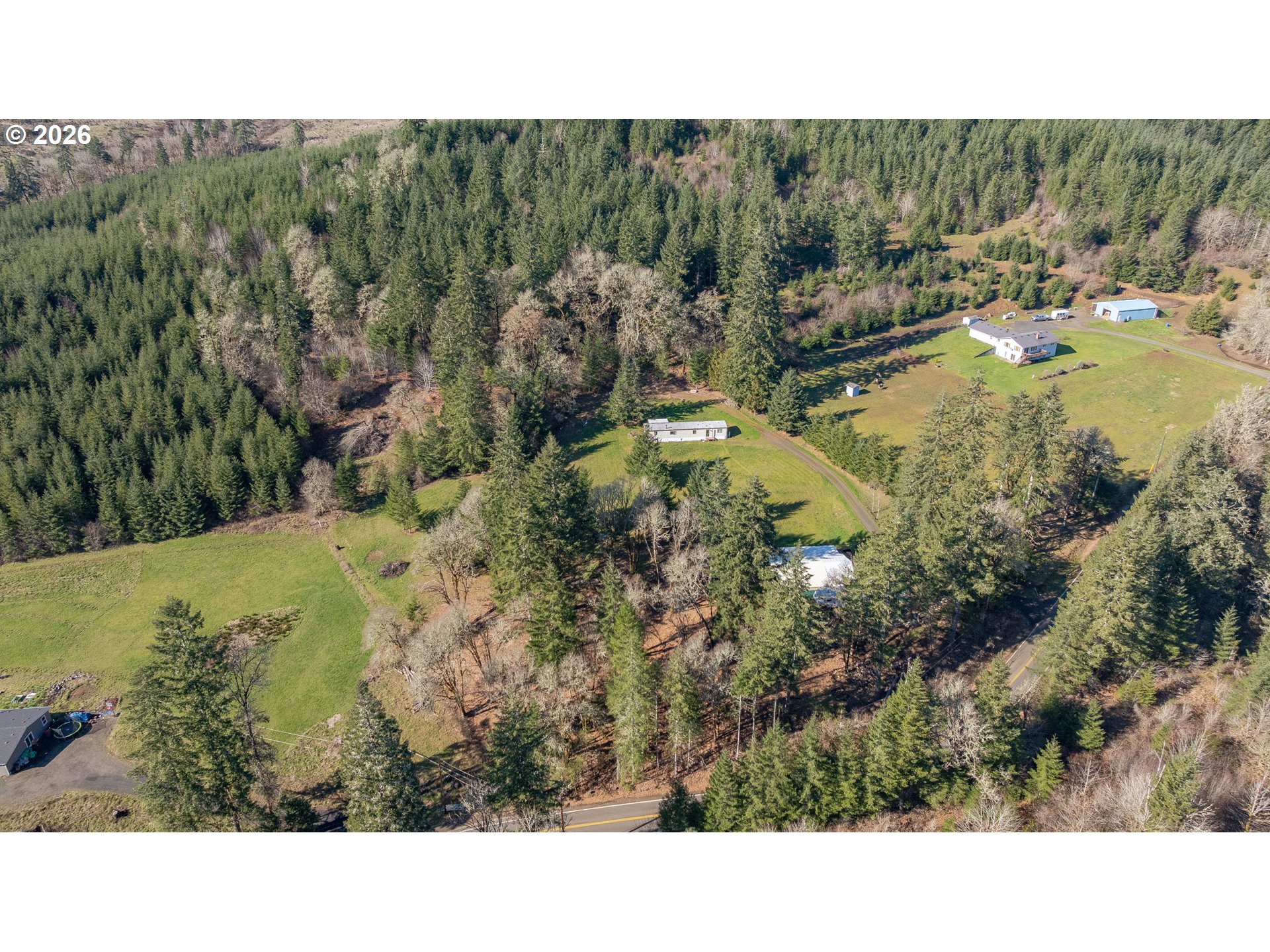 42480 Southwest Fort Hill Road Willamina, OR 97396 - Photo 11 of 35 a view of a swimming pool and trees