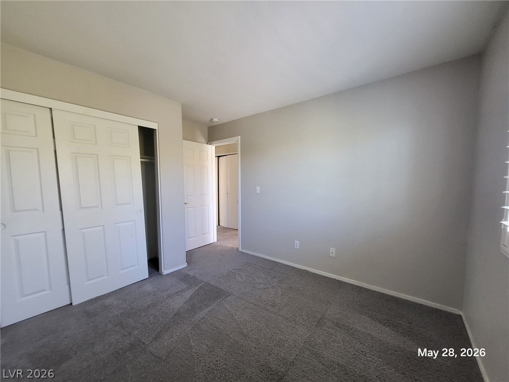 9843 West Overlook Ridge Avenue Las Vegas, NV 89148 - Photo 6 of 19 A well-proportioned room featuring soft gray carpeting and ample closet space.