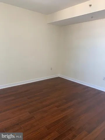 a bathroom with a granite countertop sink toilet a mirror and shower