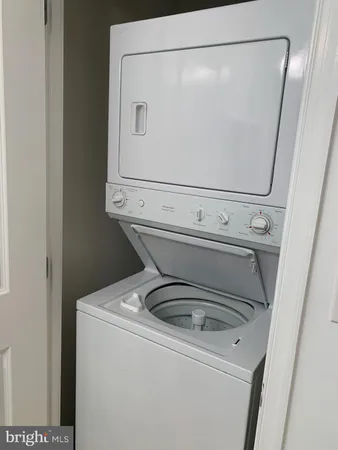 a view of a swimming pool with outdoor seating