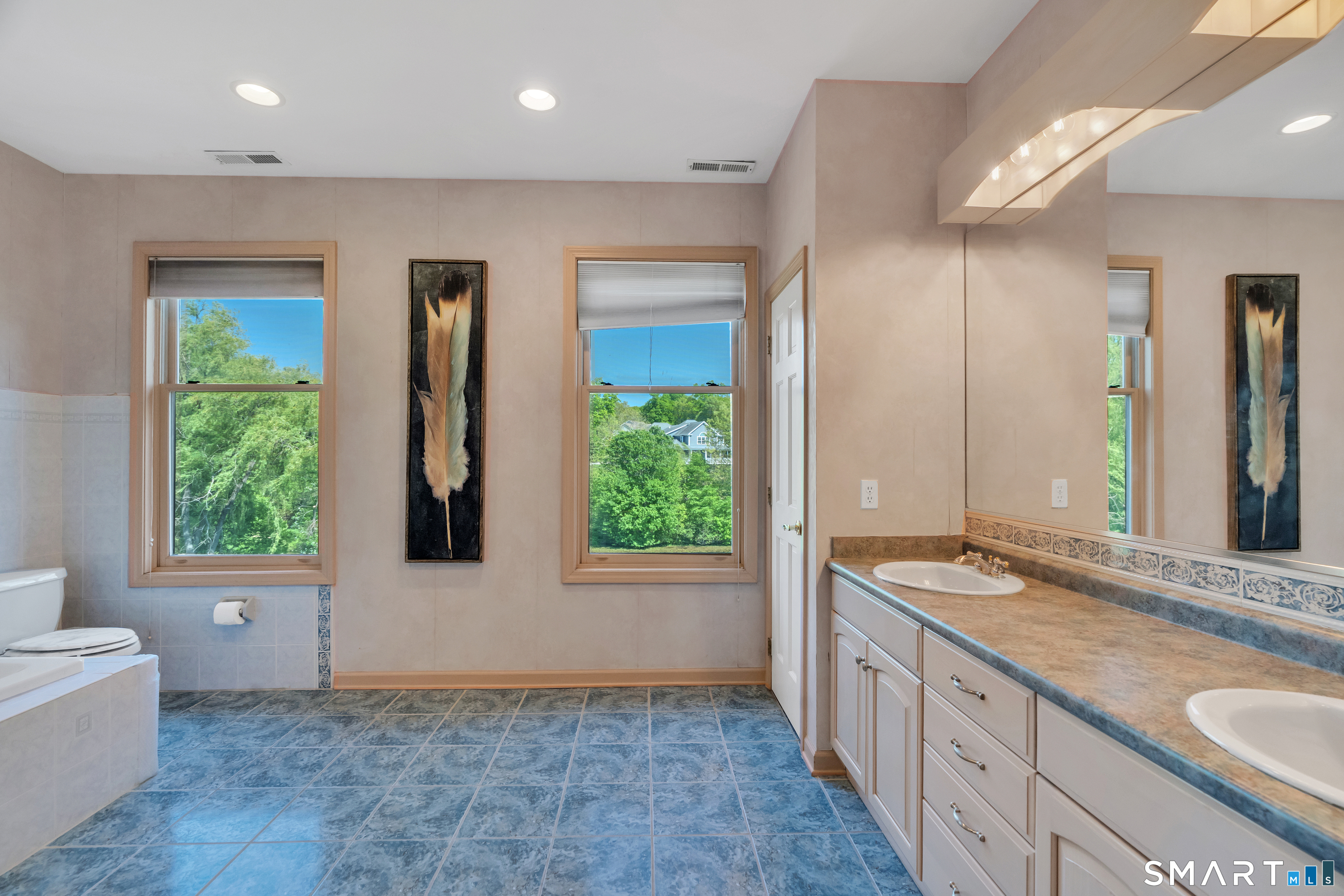 194 Quaker Farms Road Oxford, CT 06478 - Photo 21 of 40 a bathroom with a granite countertop sink and a window