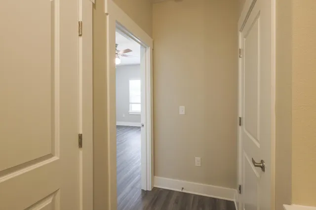 a view of a bathroom from the hallway