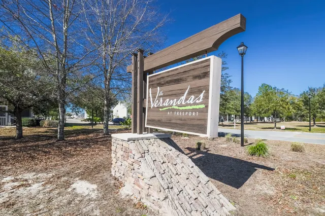 a sign board with parking space