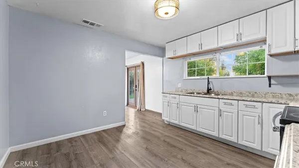 a kitchen with sink cabinets and window