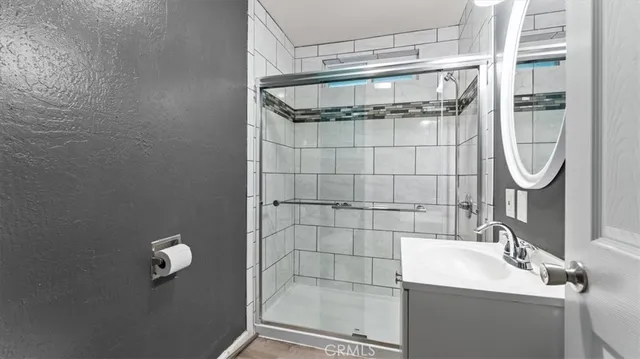 a bathroom with a sink and shower