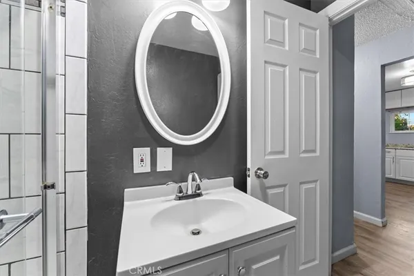 a bathroom with a sink and a mirror