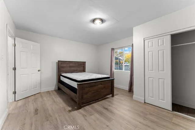 a room with wooden floors and closet