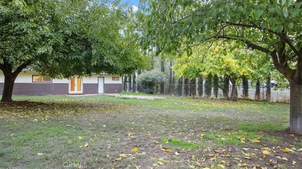 a backyard of a house with lots of green space