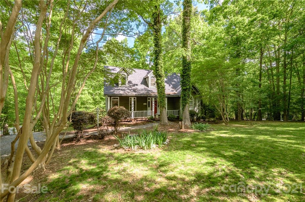 712 Lochaven Road Waxhaw, NC 28173 - Photo 1 of 38 a backyard of a house with table and chairs