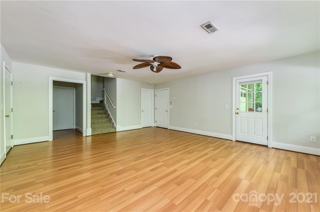 712 Lochaven Road Waxhaw, NC 28173 - Photo 25 of 38 a view of an empty room and wooden floor