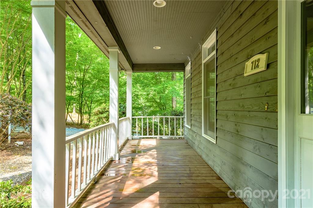 712 Lochaven Road Waxhaw, NC 28173 - Photo 5 of 38 a view of a porch with wooden floor and stairs