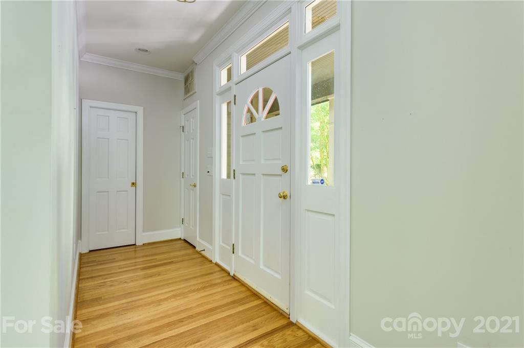 712 Lochaven Road Waxhaw, NC 28173 - Photo 6 of 38 a view of a hallway with wooden floor and entryway