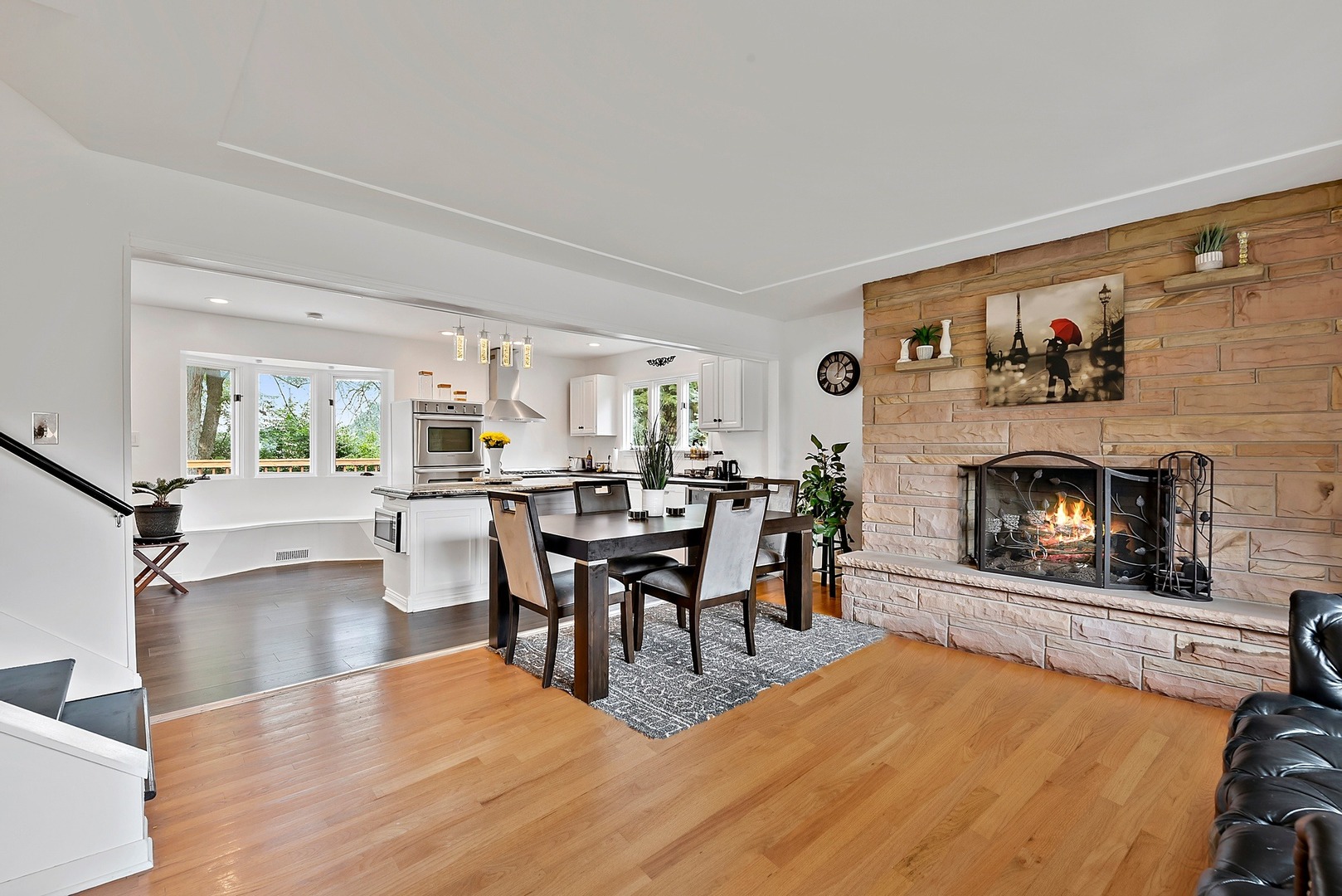 7710 Brookbank Road Willowbrook, IL 60527 - Photo 2 of 20 a living room with furniture a fireplace and a large window