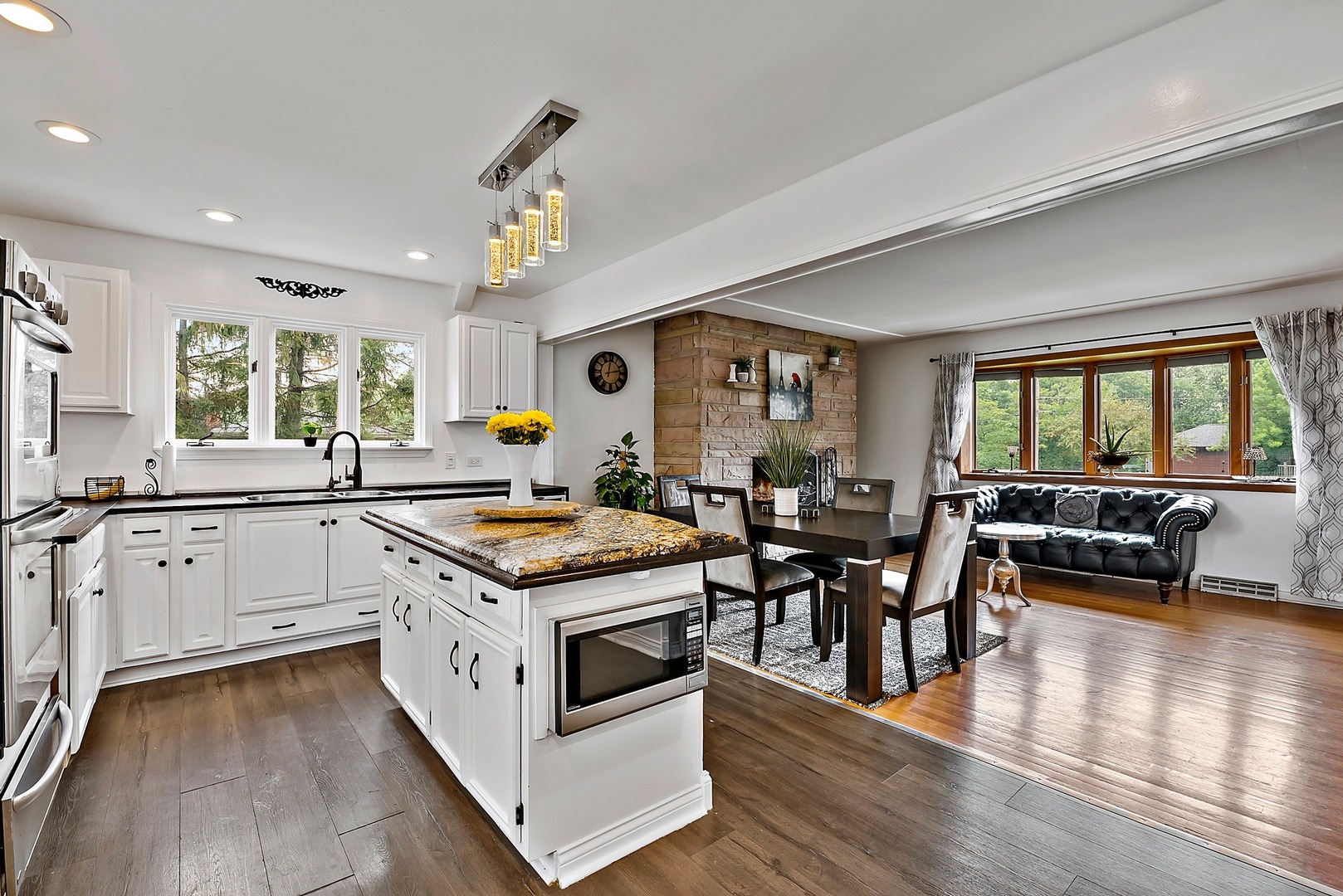 7710 Brookbank Road Willowbrook, IL 60527 - Photo 5 of 20 a kitchen with granite countertop stove a table and chairs in it