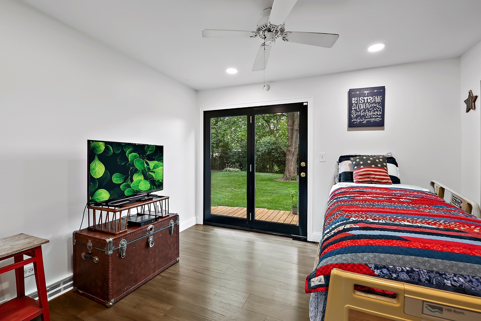 7710 Brookbank Road Willowbrook, IL 60527 - Photo 8 of 20 a living room with furniture and a flat screen tv