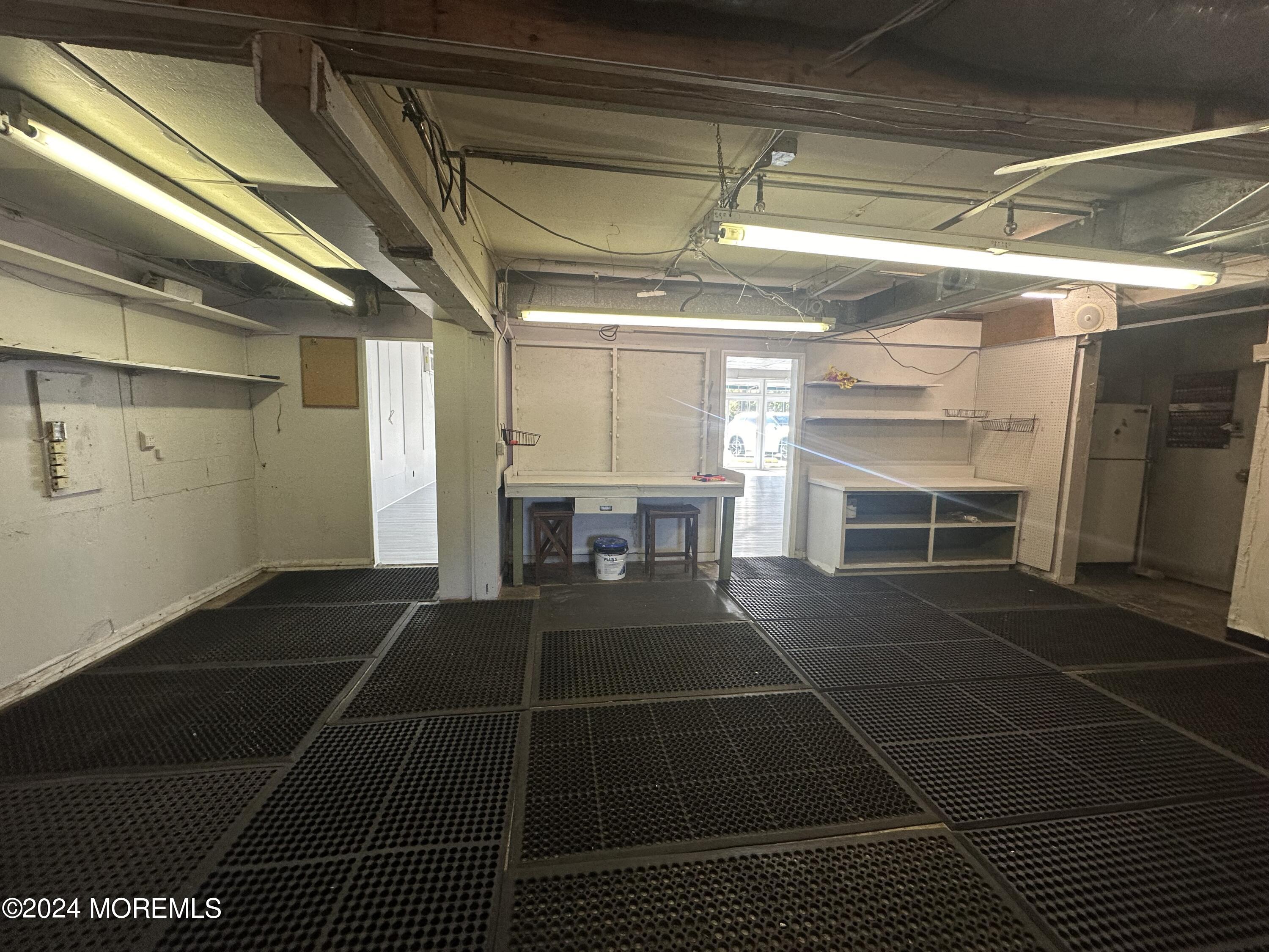 570 Mantoloking Road Brick, NJ 08723 - Photo 13 of 23 a room with a black white checkered floor