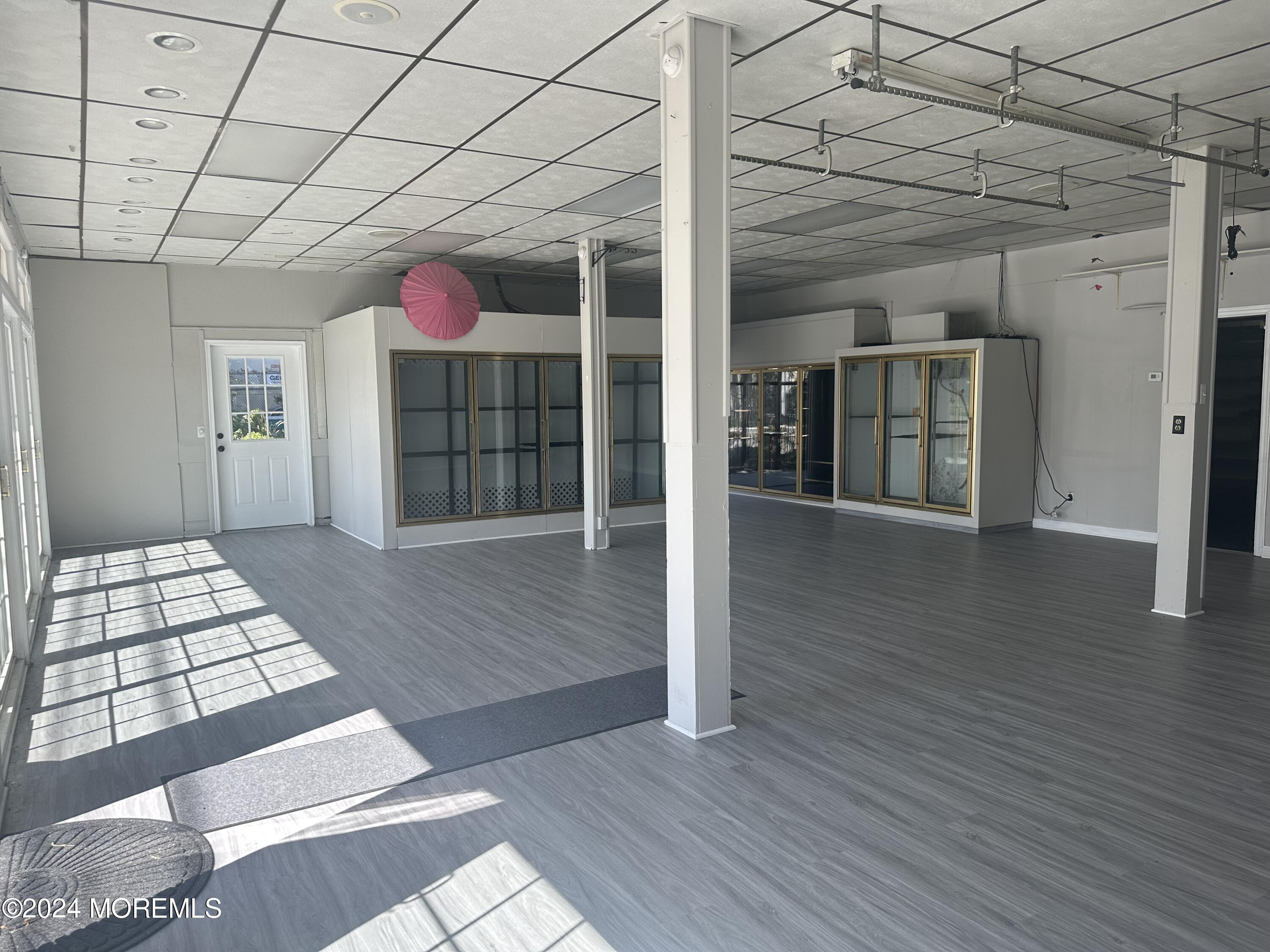 570 Mantoloking Road Brick, NJ 08723 - Photo 19 of 23 a view of a room with wooden floor and cabinet