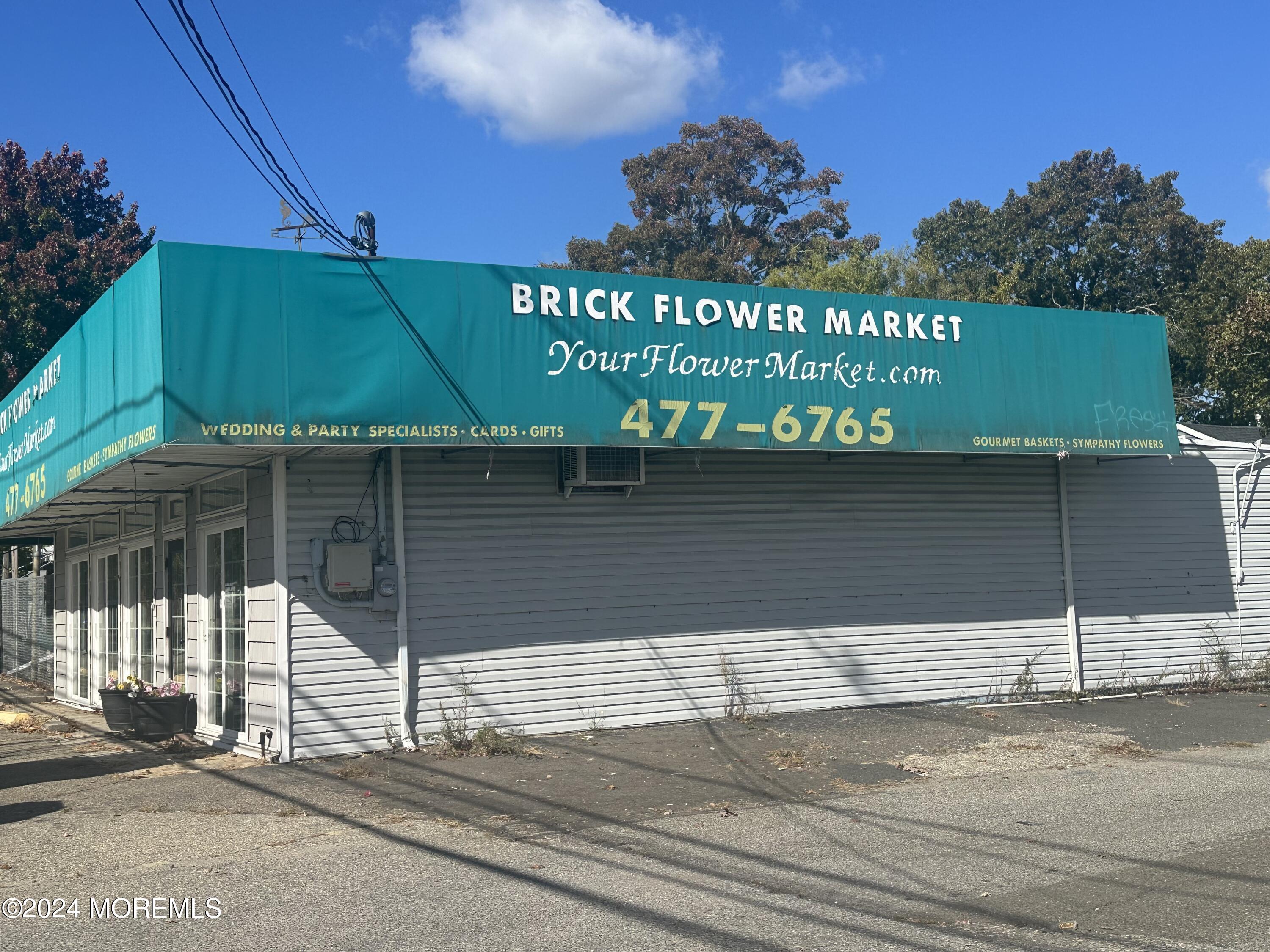 570 Mantoloking Road Brick, NJ 08723 - Photo 23 of 23 a street sign on a street sign