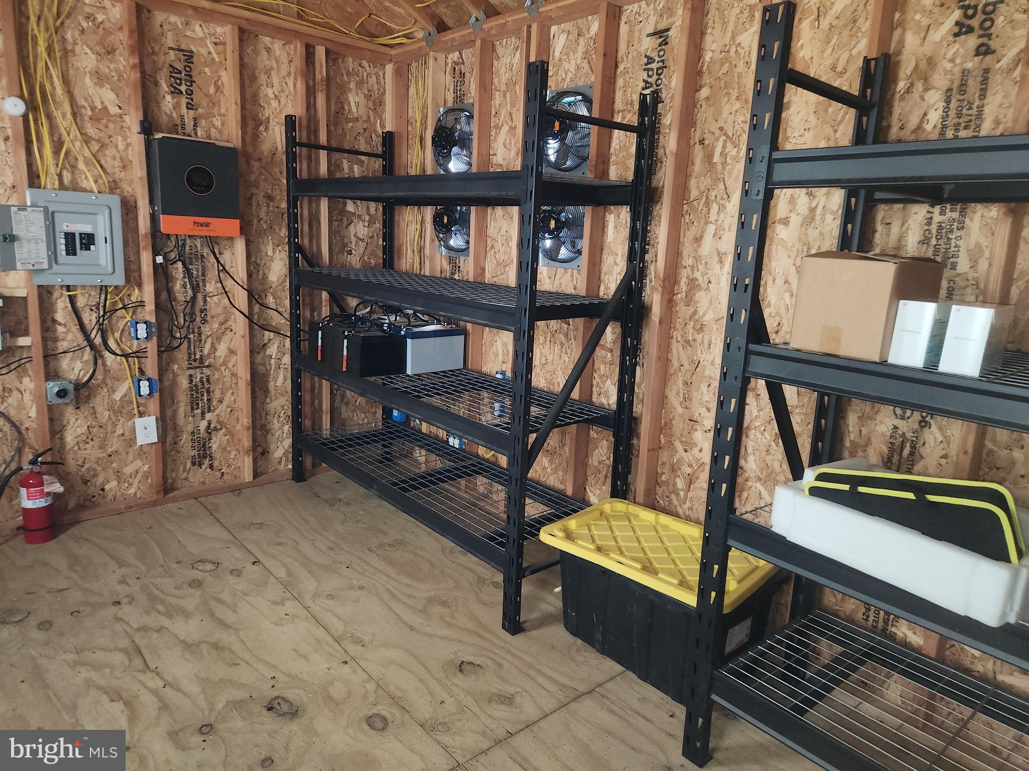 203 Platt Avenue Wrightstown, NJ 08562 - Photo 14 of 15 a living room with furniture a rug and a book shelf