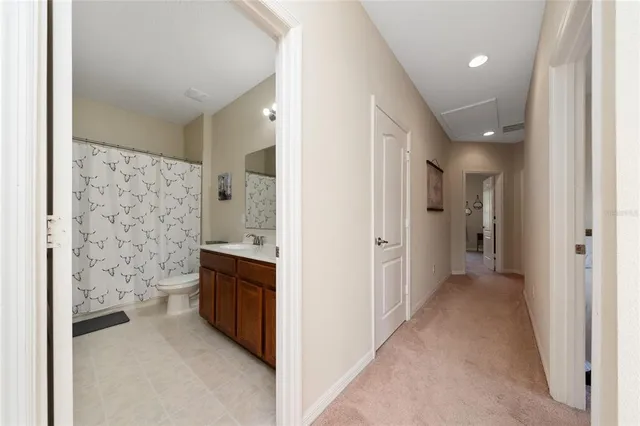 a view of a bathroom with a sink and a mirror