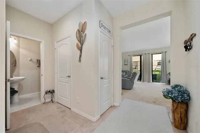 a view of a hallway with paintings on the wall