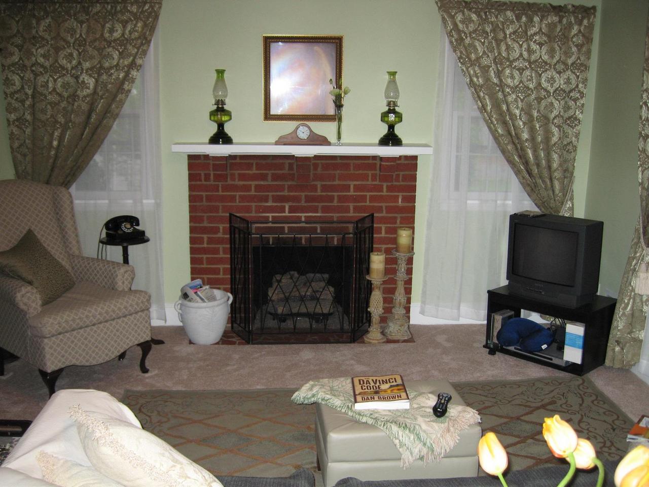 203 Knoll Road Roanoke, VA 24019 - Photo 5 of 11 a living room with furniture a fireplace and a flat screen tv