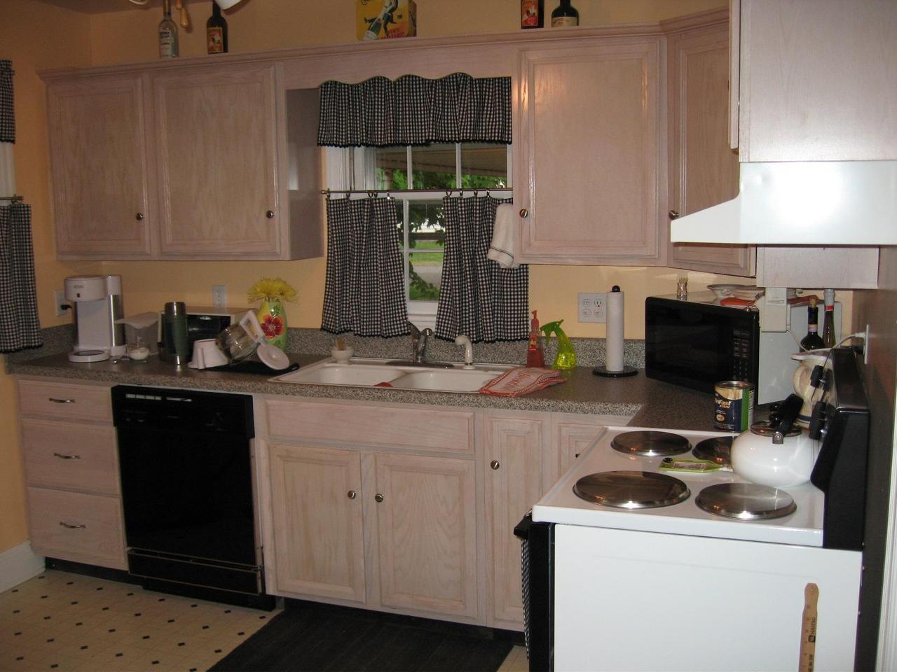 203 Knoll Road Roanoke, VA 24019 - Photo 7 of 11 a kitchen with a sink and cabinets