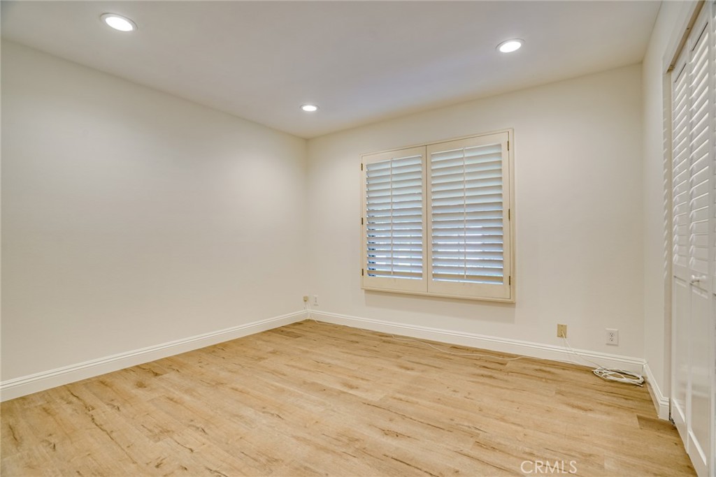49 East Yale Loop, Unit 26 Irvine, CA 92604 - Photo 21 of 63 wooden floor in an empty room with a window