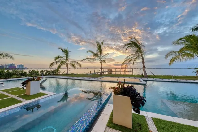 a view of a ocean with couches and chairs