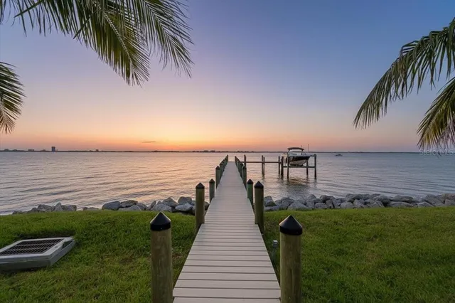 a view of a house with swimming pool and a yard