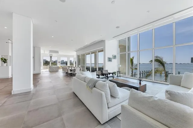 a lobby with furniture and floor to ceiling window