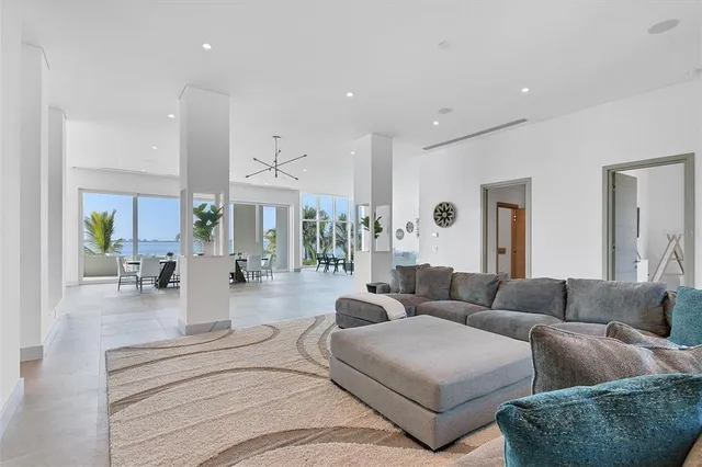 a lobby with furniture and a potted plant