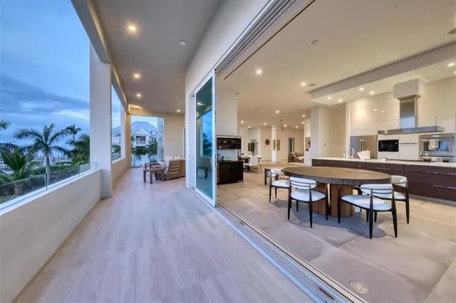 a large kitchen with a stove a refrigerator and a sink