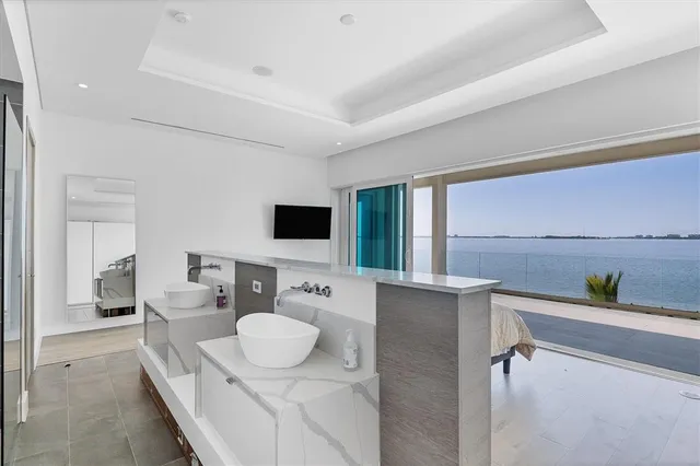 a view of a living room and floor to ceiling window or wooden floor