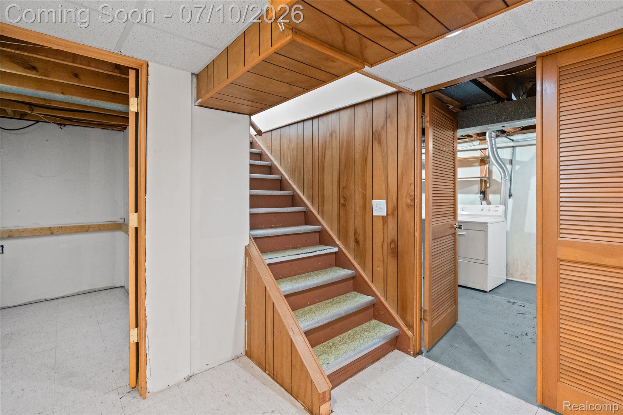 1715 North Oxford Road Oxford, MI 48371 - Photo 20 of 29 Wood-paneled staircase with carpeted treads